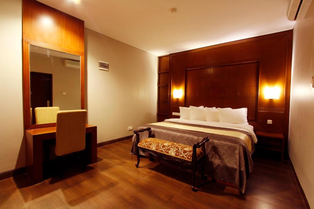 Postel nebo postele na pokoji v ubytování Grand Hatika Hotel