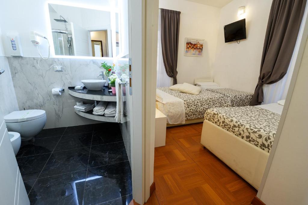 A bed or beds in a room at Il Fascino Di Roma