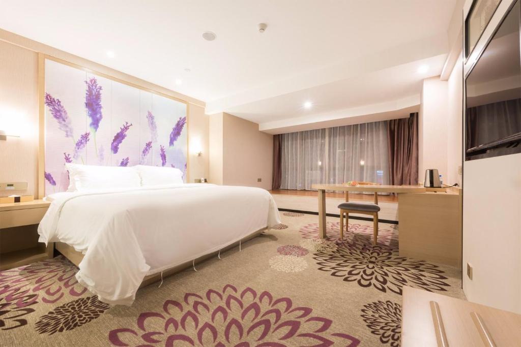 Postel nebo postele na pokoji v ubytování Lavande Hotel HeYuan Wanlong City
