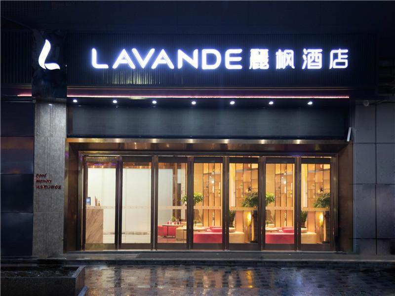 a building with a sign on the front of it at Lavande Hotel Yanan Pagoda Mountain in Yan'an