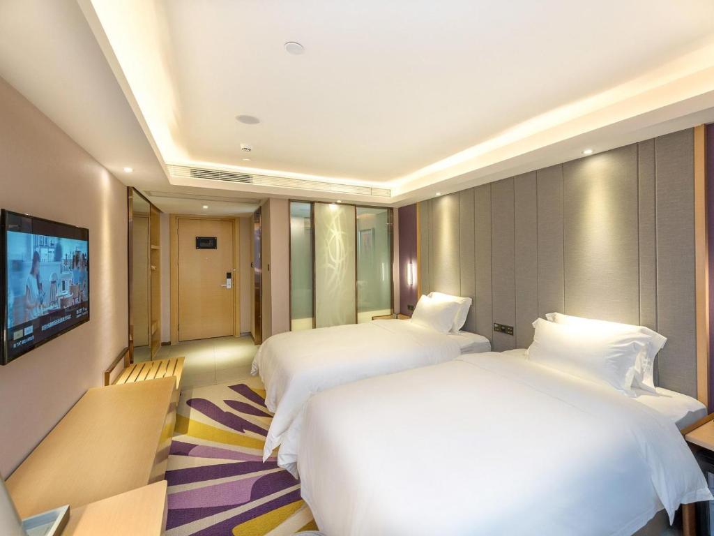 TV a/nebo společenská místnost v ubytování Lavande Hotel Zigong Tanmulin Lantern Park