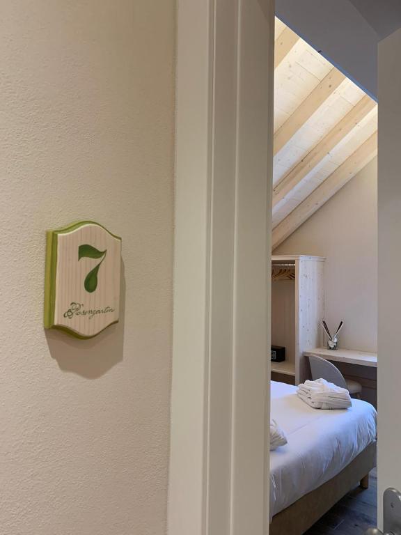 Postel nebo postele na pokoji v ubytování Hotel Rosengarten
