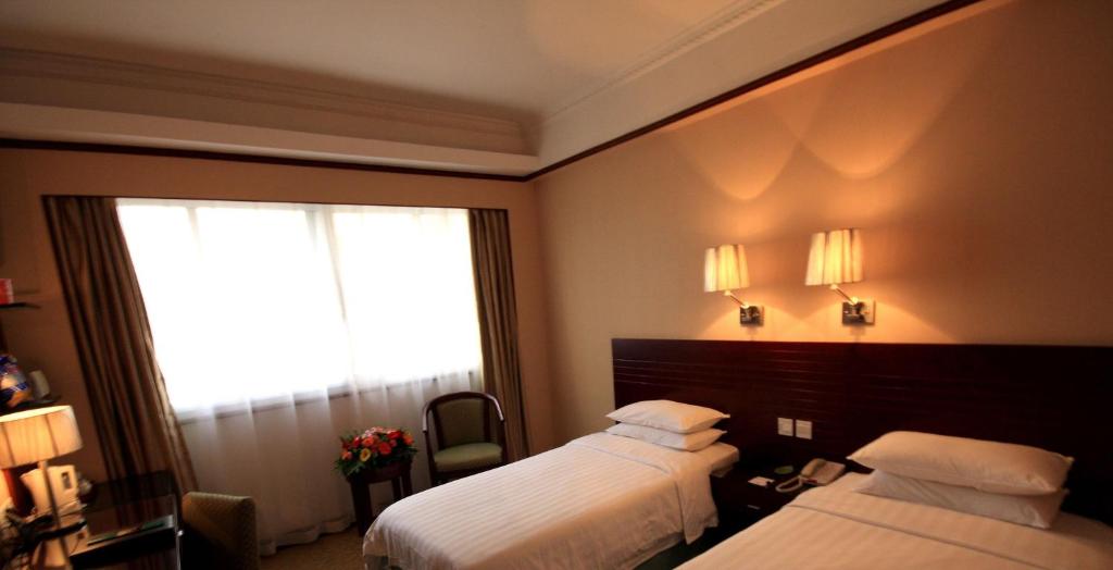 Postel nebo postele na pokoji v ubytování Holiday Inn Express Xiamen Lushan -Shopping Center by IHG