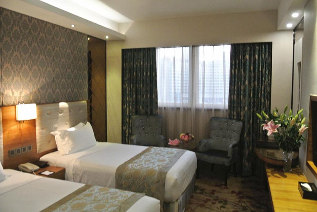 Postel nebo postele na pokoji v ubytování Holiday Inn Express Xiamen Lushan -Shopping Center by IHG