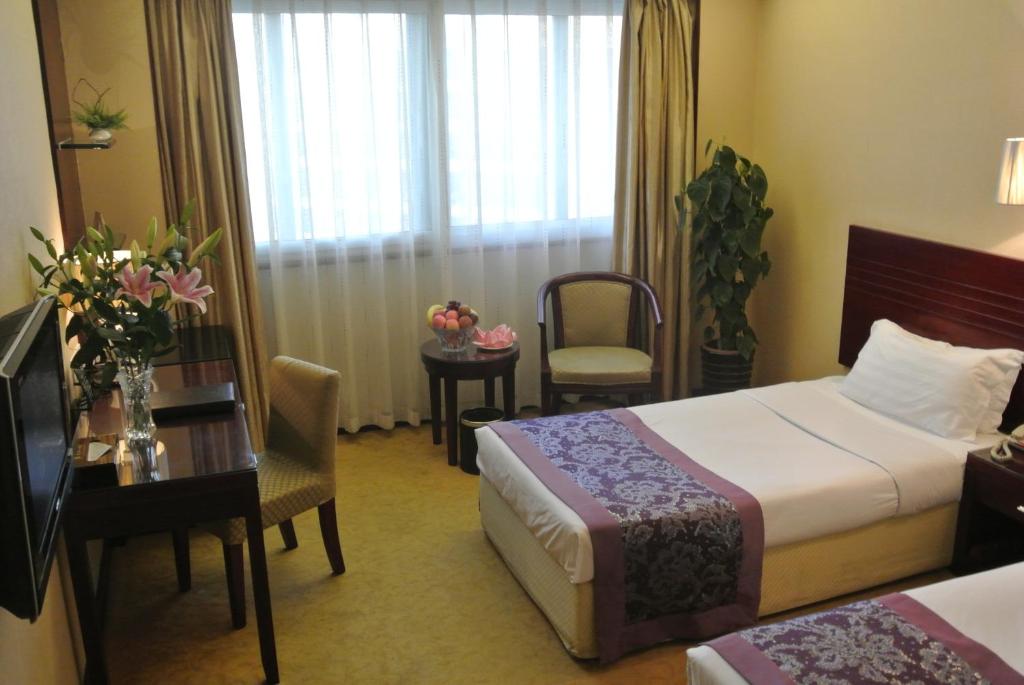 Postel nebo postele na pokoji v ubytování Holiday Inn Express Xiamen Lushan -Shopping Center by IHG