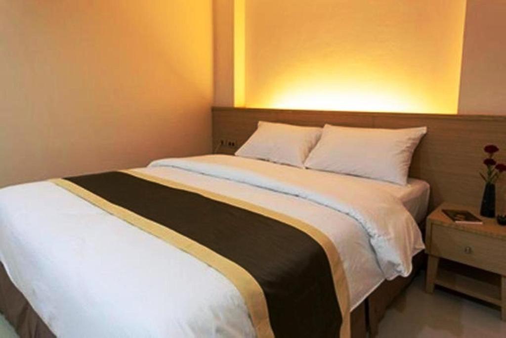 Postel nebo postele na pokoji v ubytování Gateway Hotel Pratunam
