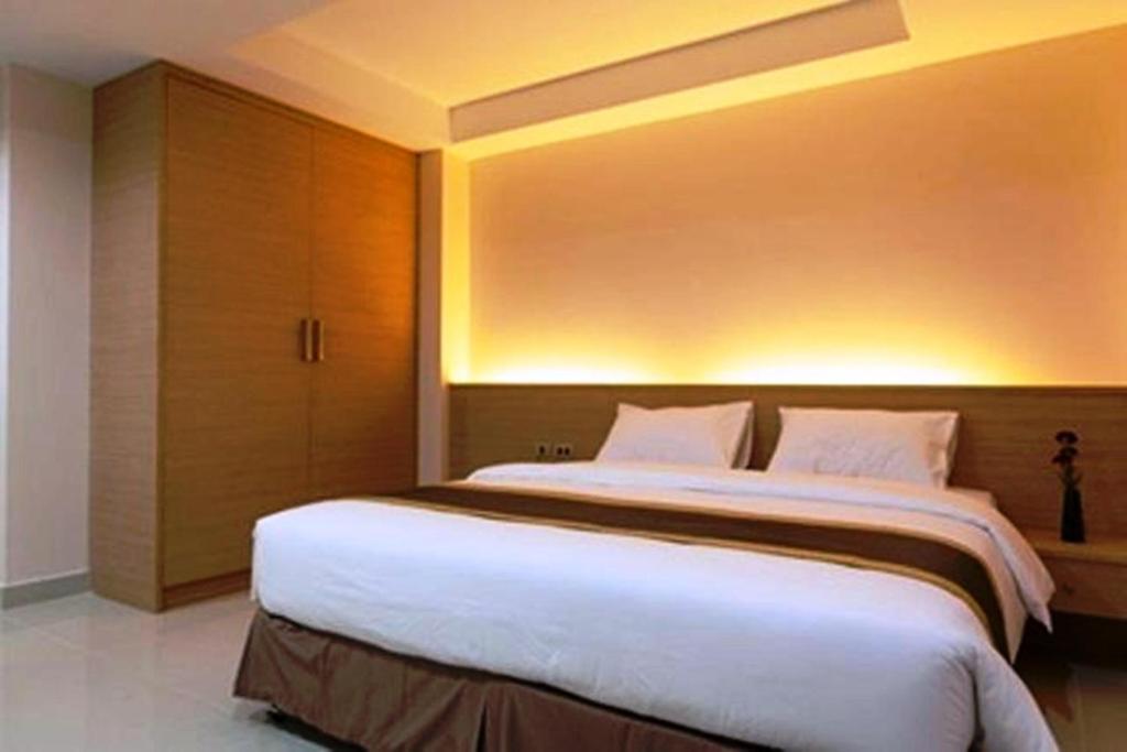 Postel nebo postele na pokoji v ubytování Gateway Hotel Pratunam