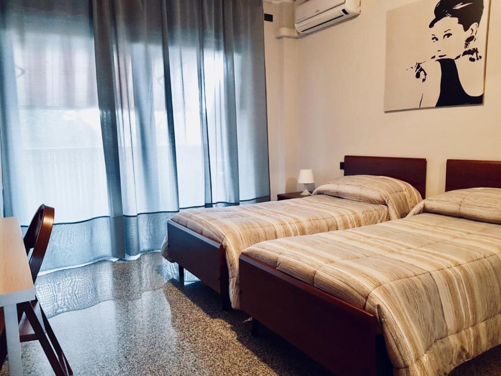 Ліжко або ліжка в номері Appartamenti Rho Fiera