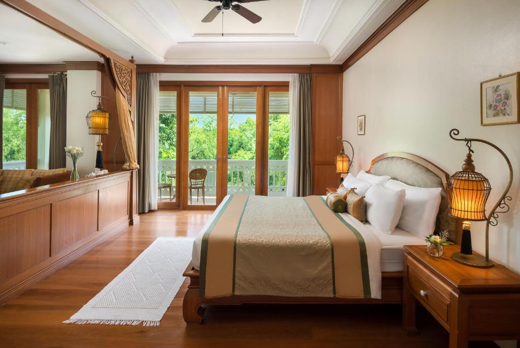 Postel nebo postele na pokoji v ubytování Dheva Mantra Resort