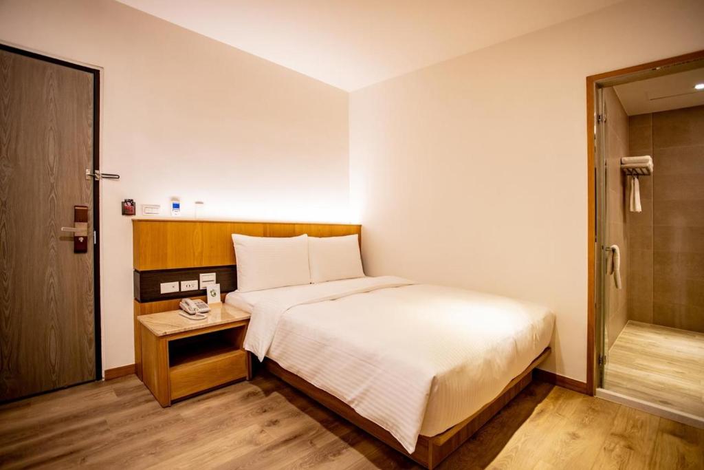 Postel nebo postele na pokoji v ubytování Beauty Avenue Inn