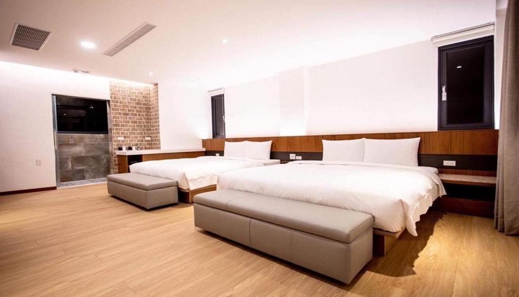 Postel nebo postele na pokoji v ubytování Beauty Avenue Inn