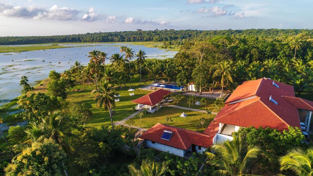 an aerial view of a resort with a body of water at The Notary's House in Makandura