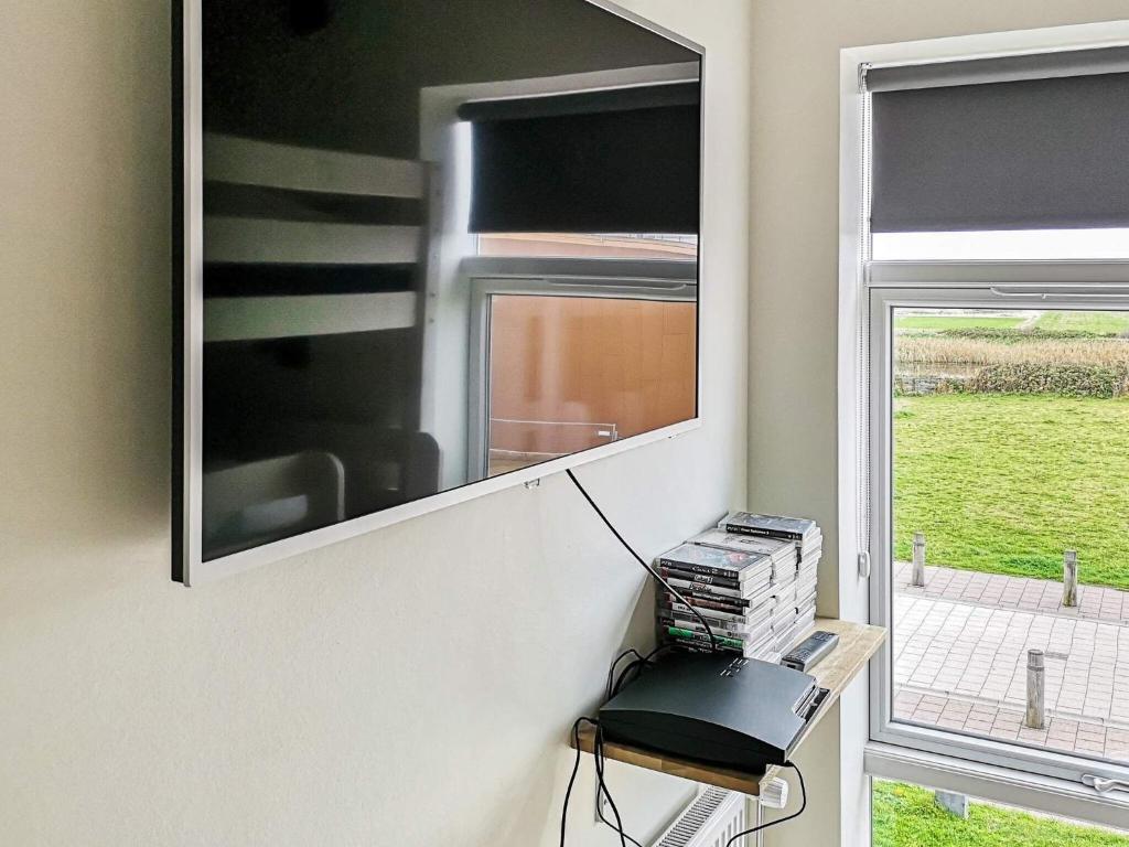 TV a/nebo společenská místnost v ubytování Luxury Spa Apartment in Sondervig - By Traum Ferienwohnungen