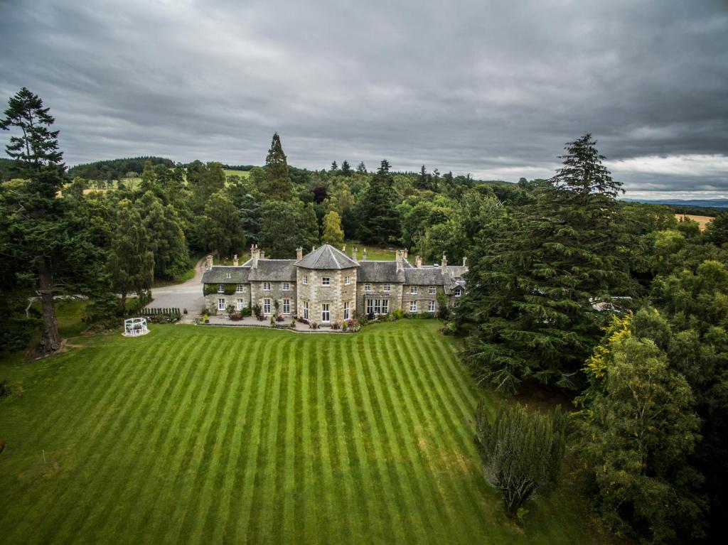 an aerial view of a large house with a large yard at Coul House Hotel in Contin
