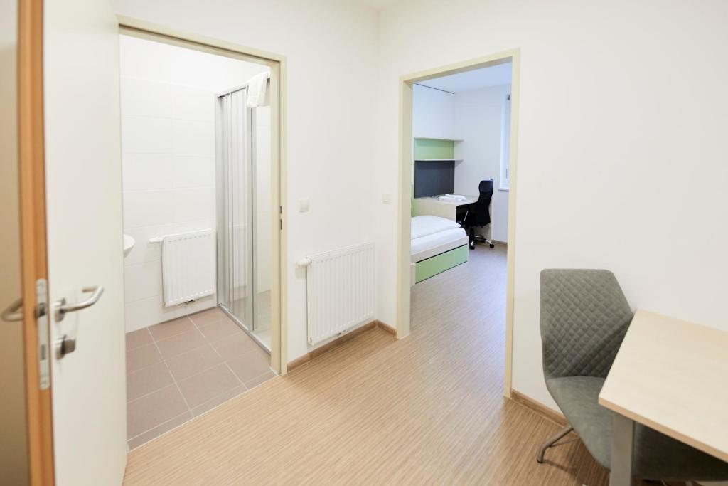 TV a/nebo společenská místnost v ubytování I AM HOTEL im Living Campus