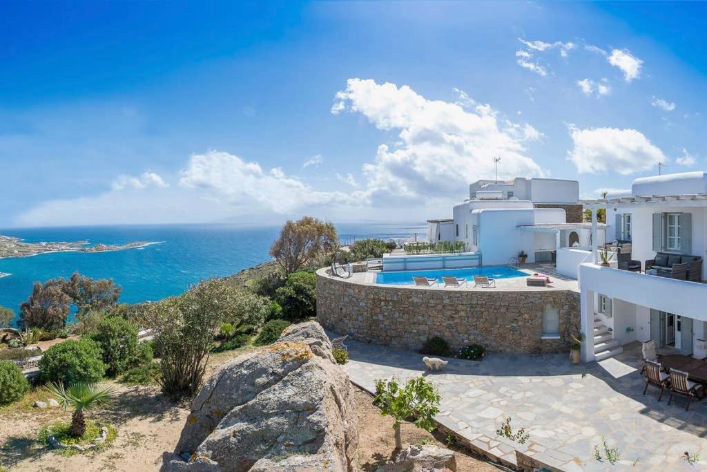 a villa with a view of the ocean at Mykonos Psarrou villas for 18 people in Mýkonos City