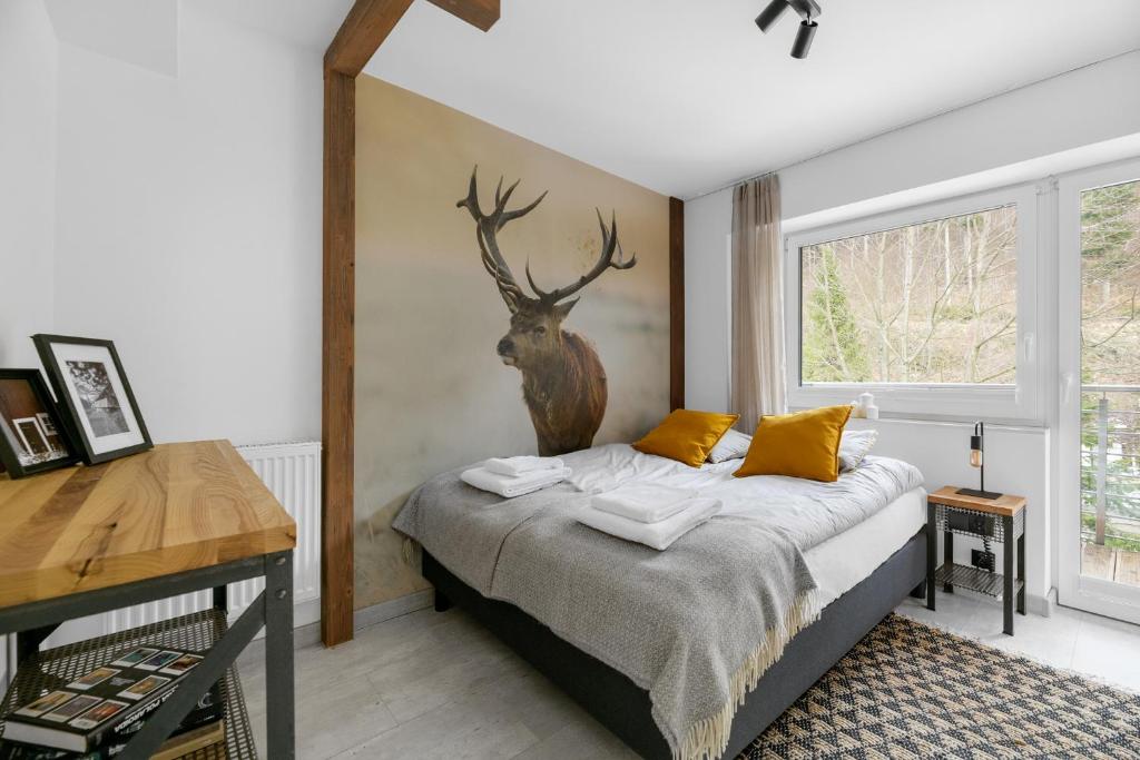 Voodi või voodid majutusasutuse Aparthotel Narciarska 2 toas