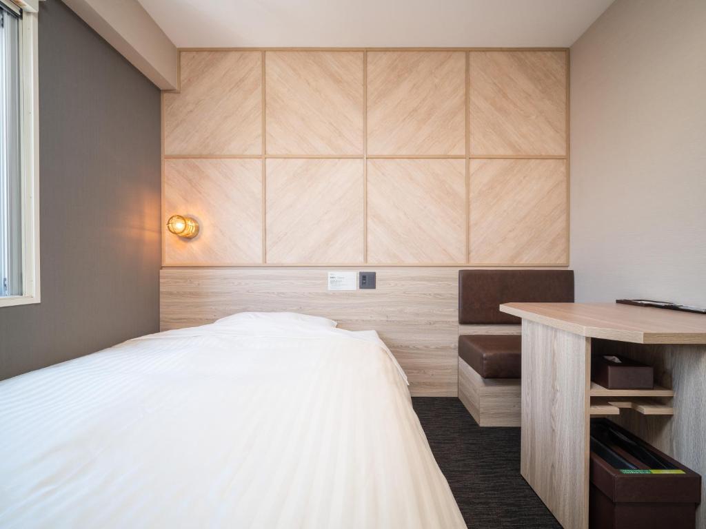 Postel nebo postele na pokoji v ubytování Super Hotel Gotenba - 1