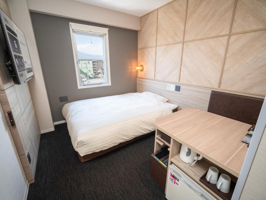 Postel nebo postele na pokoji v ubytování Super Hotel Gotenba - 1