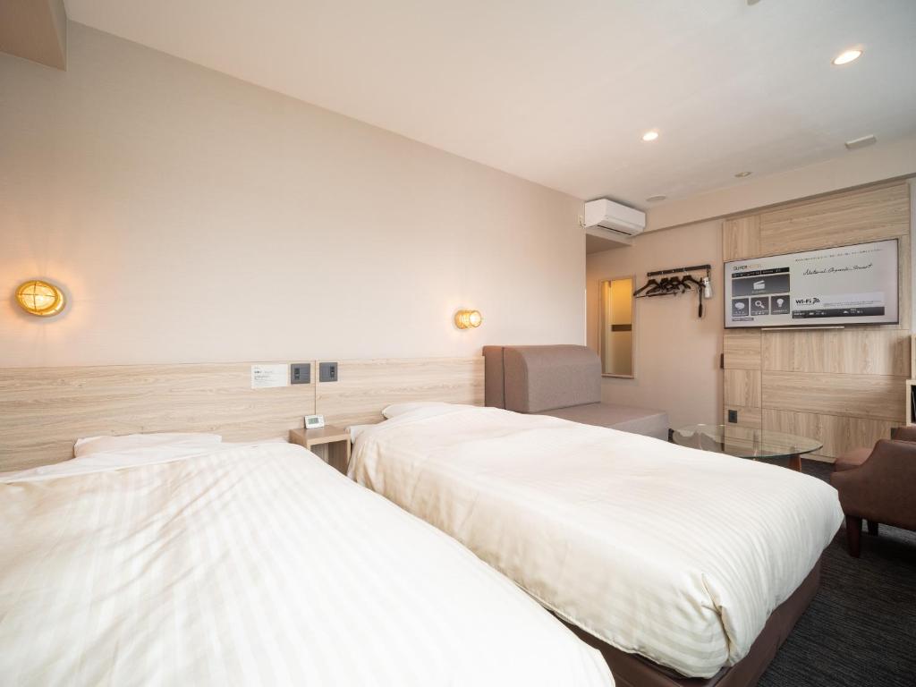 Postel nebo postele na pokoji v ubytování Super Hotel Gotenba - 1