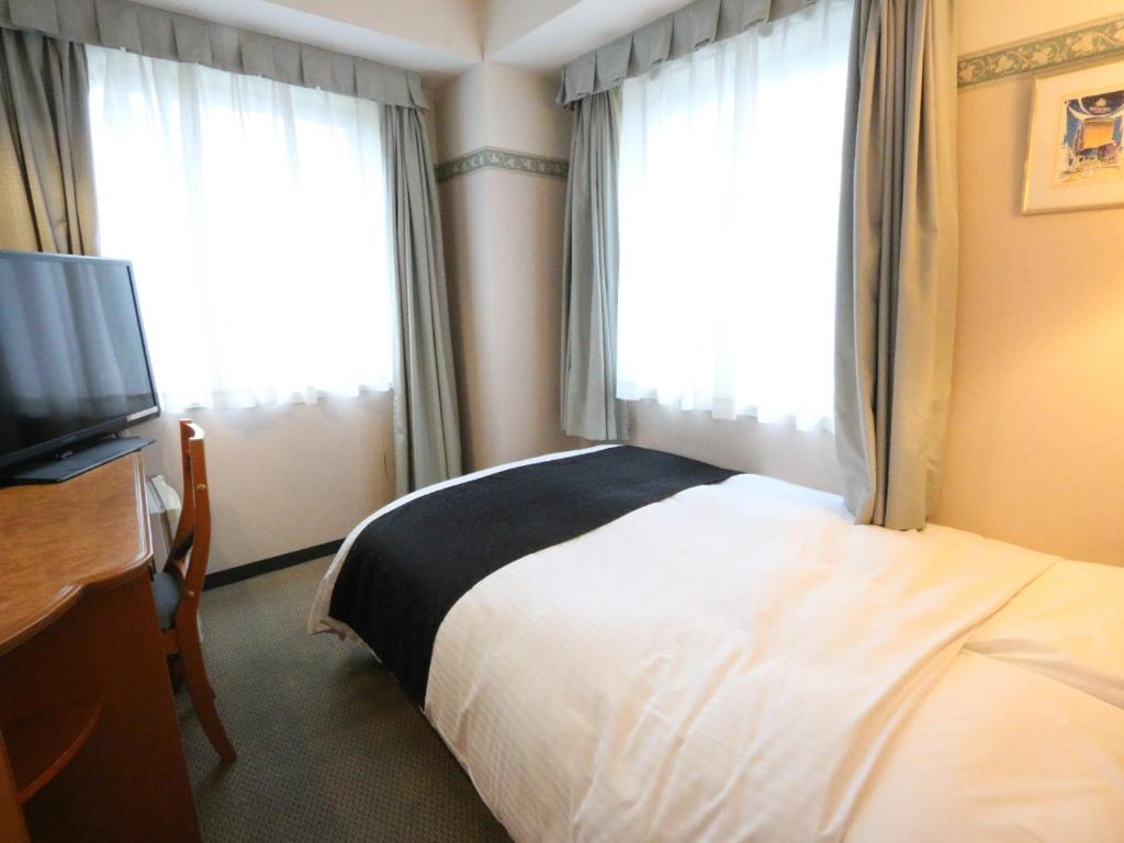 TV a/nebo společenská místnost v ubytování APA Hotel Fukui Katamachi