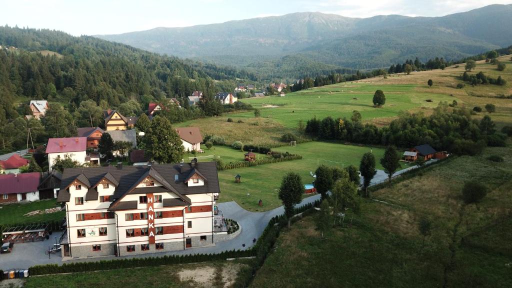 an aerial view of a large building in a valley at OSRODEK WCZASOWY HANKA in Zawoja