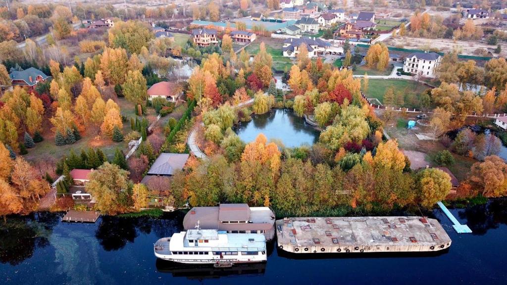 two boats are docked in the water on a lake at On The River in Vishenki