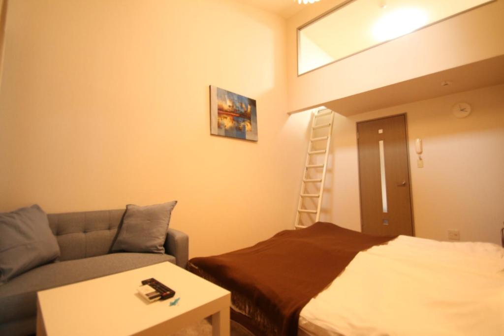 A bed or beds in a room at Espor Shinmachi simple accommodation / Vacation STAY 81089