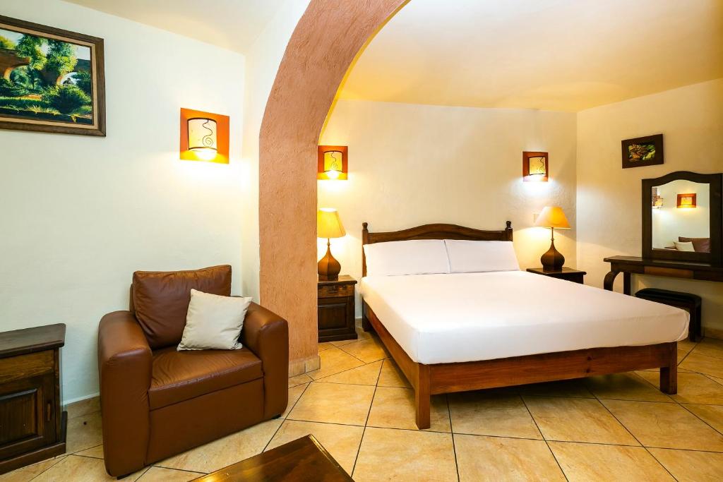 Postel nebo postele na pokoji v ubytování Hotel Casa del Virrey & Suites