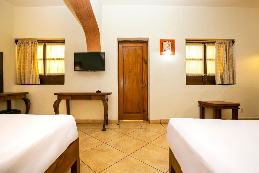TV a/nebo společenská místnost v ubytování Hotel Casa del Virrey & Suites