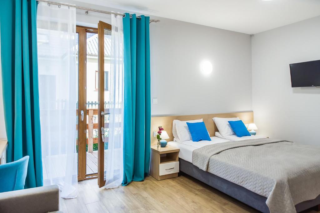 Postel nebo postele na pokoji v ubytování Kubryk