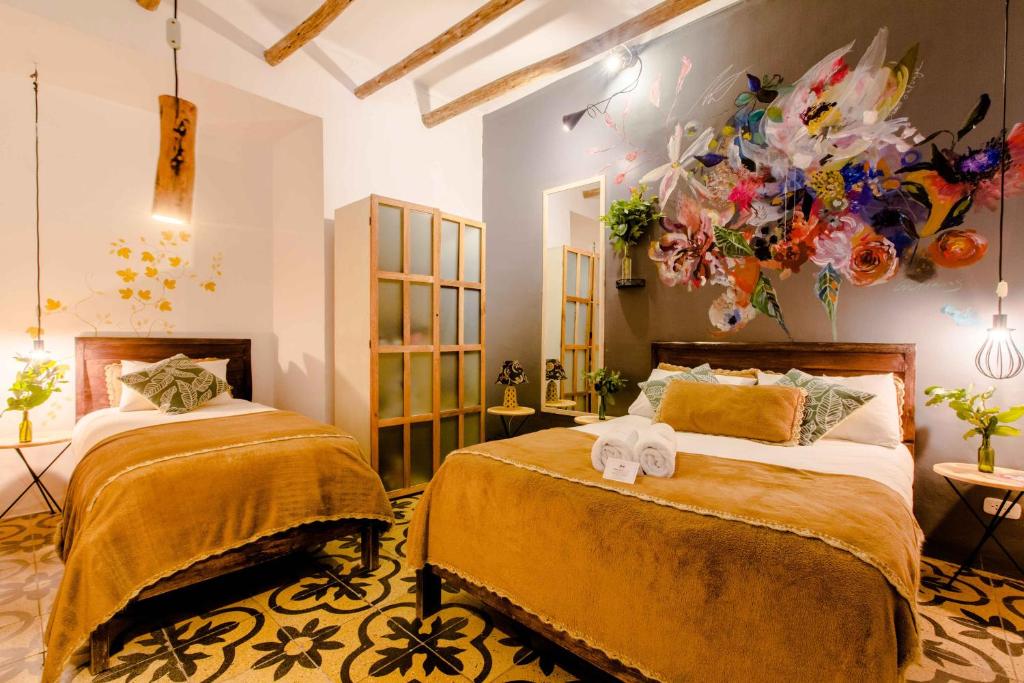 Postel nebo postele na pokoji v ubytování Niños Hotel Meloc