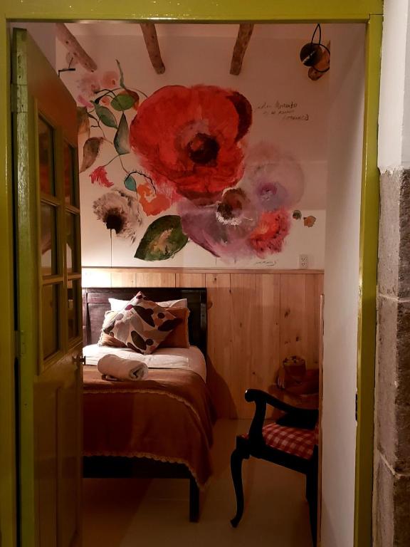 Postel nebo postele na pokoji v ubytování Niños Hotel Meloc