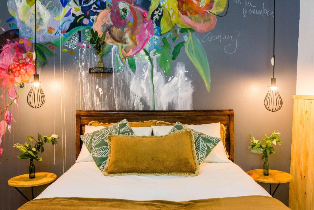 Postel nebo postele na pokoji v ubytování Niños Hotel Meloc