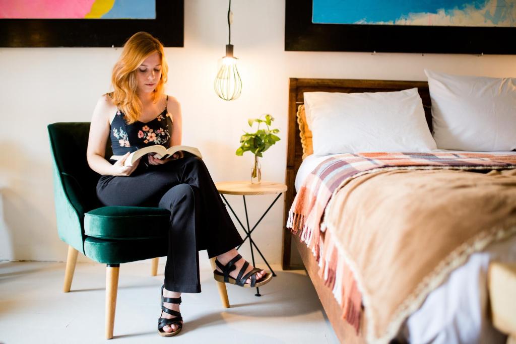 Postel nebo postele na pokoji v ubytování Niños Hotel Meloc