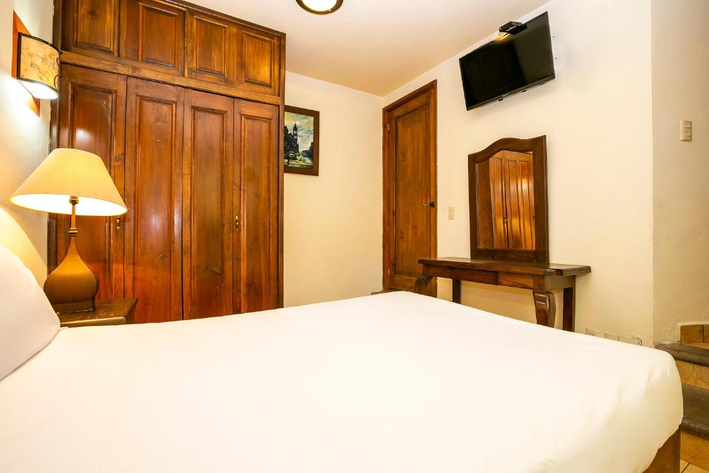 Postel nebo postele na pokoji v ubytování Hotel Casa del Virrey & Suites