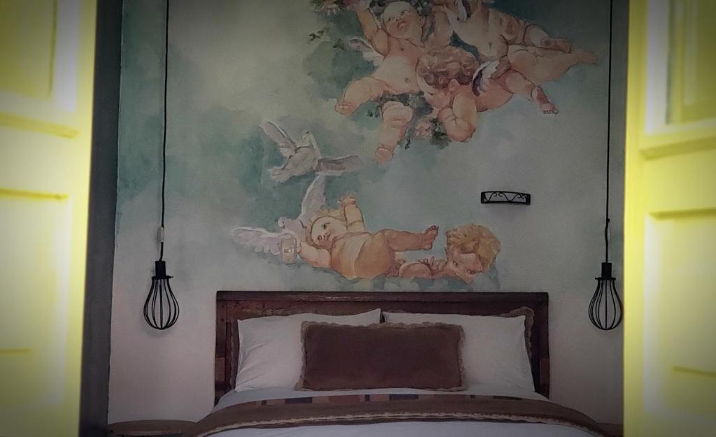 Postel nebo postele na pokoji v ubytování Niños Hotel Meloc