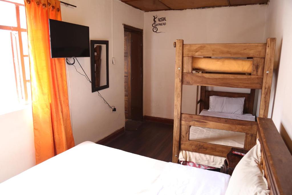 Postel nebo postele na pokoji v ubytování Hostal CQ Chapinero