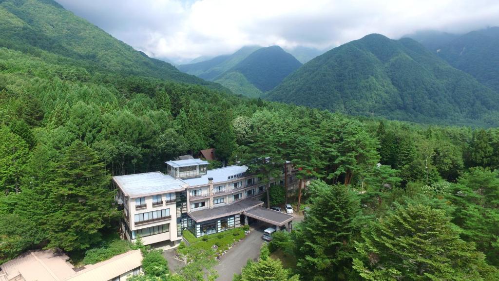 an aerial view of a building in the mountains at Suzuranso in Komagane