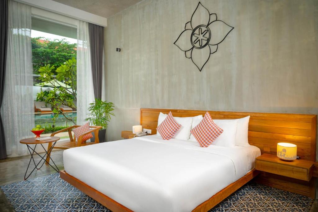 Postel nebo postele na pokoji v ubytování Phka Chan Hotel