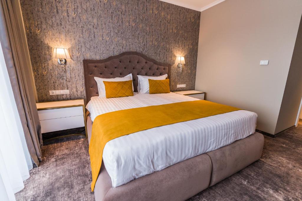 Postel nebo postele na pokoji v ubytování Hotel Aventus