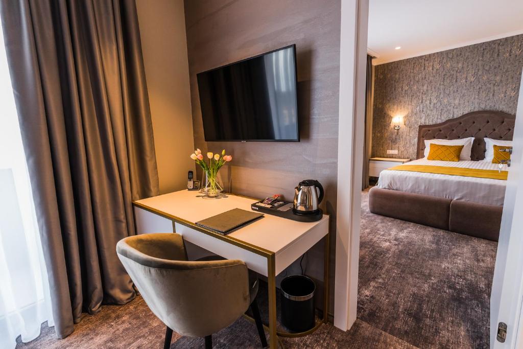 Postel nebo postele na pokoji v ubytování Hotel Aventus
