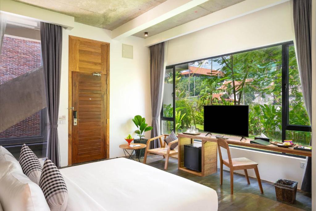 TV a/nebo společenská místnost v ubytování Phka Chan Hotel