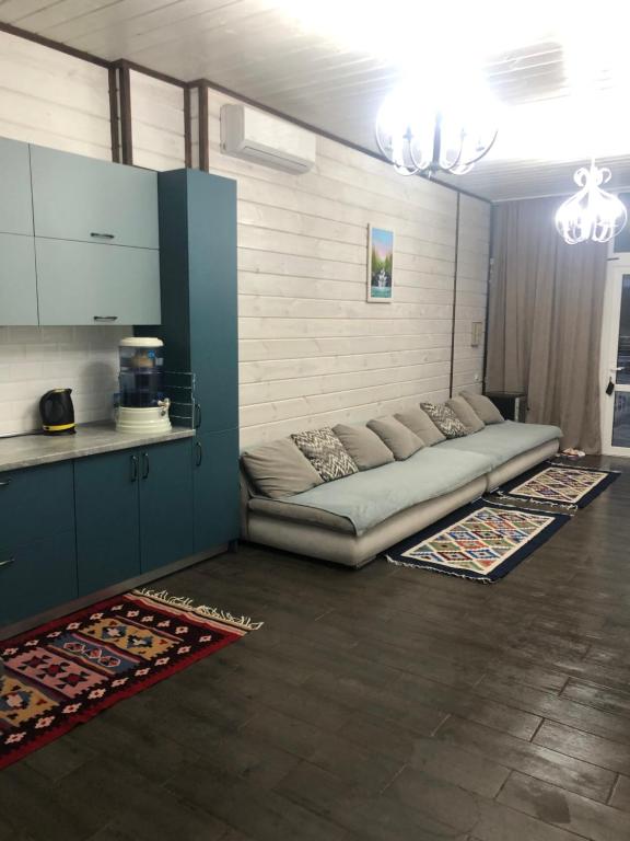 a bed in a room with two rugs at Apartamenty u moria in Karolino-Buhaz