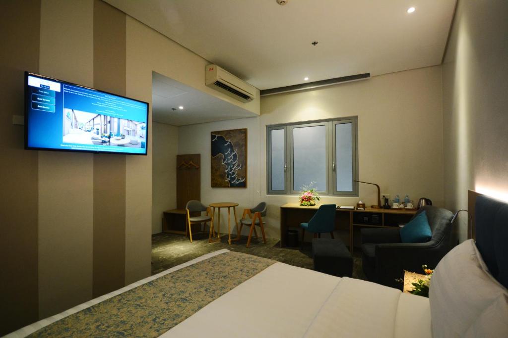 TV a/nebo společenská místnost v ubytování Blue Lotus Hotel