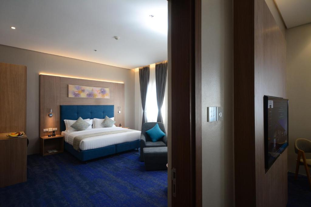 Postel nebo postele na pokoji v ubytování Blue Lotus Hotel