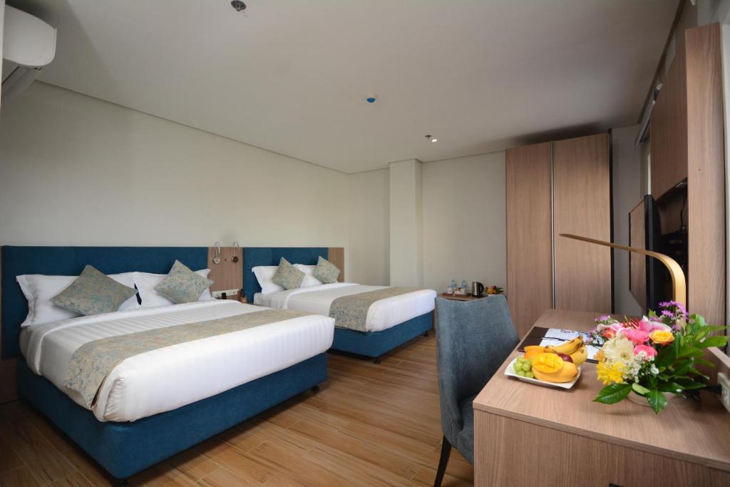 Postel nebo postele na pokoji v ubytování Blue Lotus Hotel