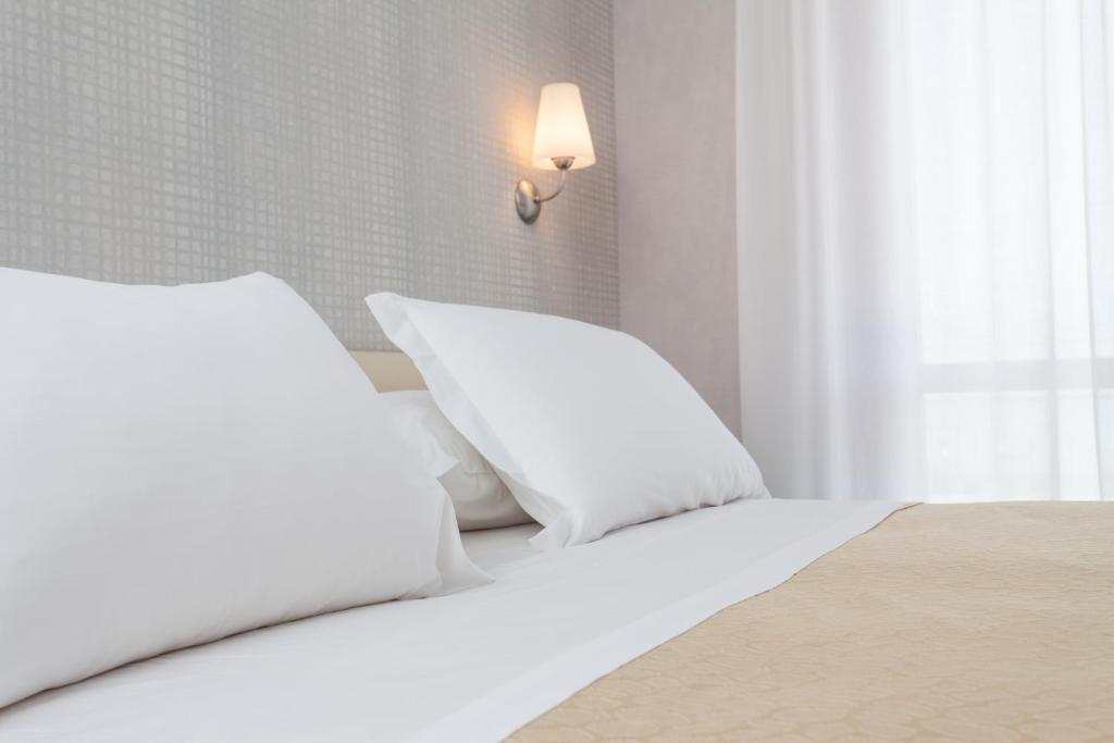 Postel nebo postele na pokoji v ubytování Hotel Esplanade