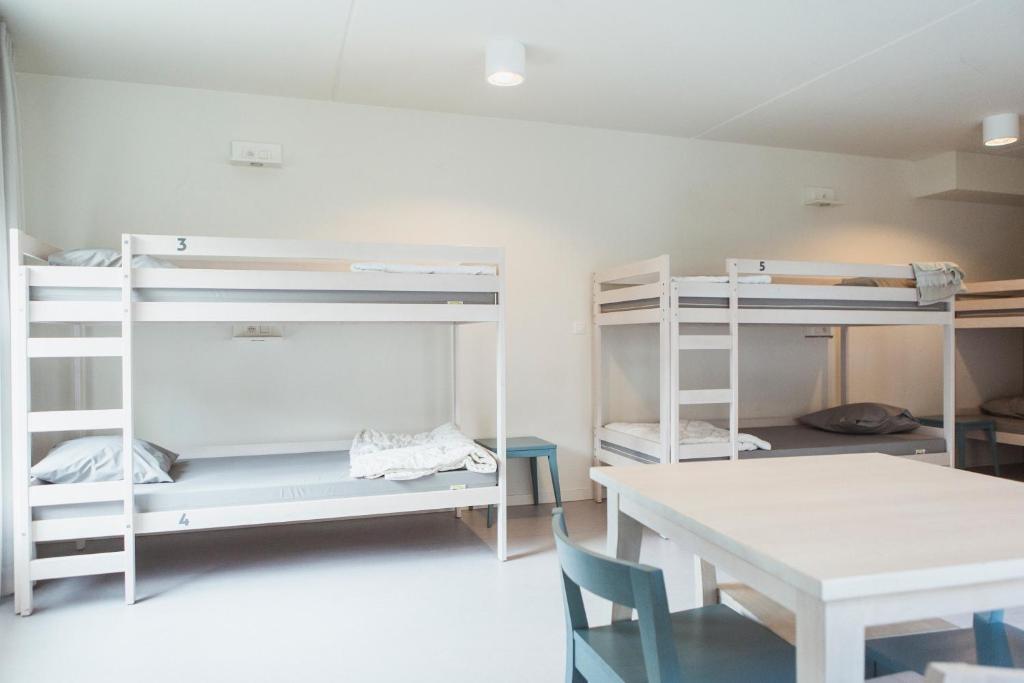 Postel nebo postele na pokoji v ubytování Snuffel Youth Hostel