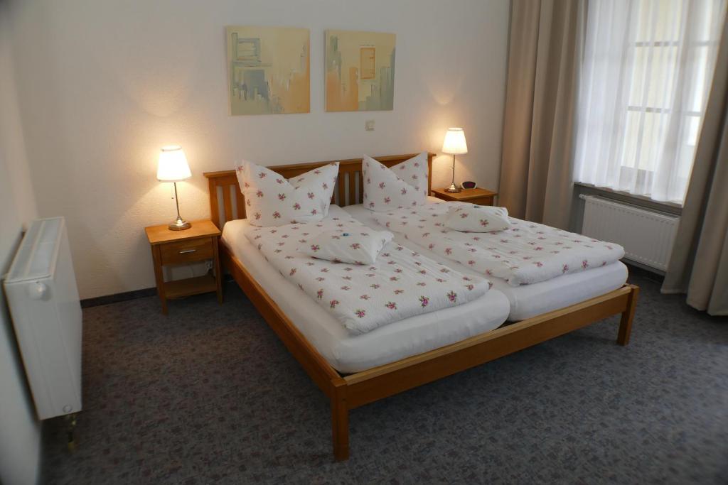 Postel nebo postele na pokoji v ubytování Hotel Meridian